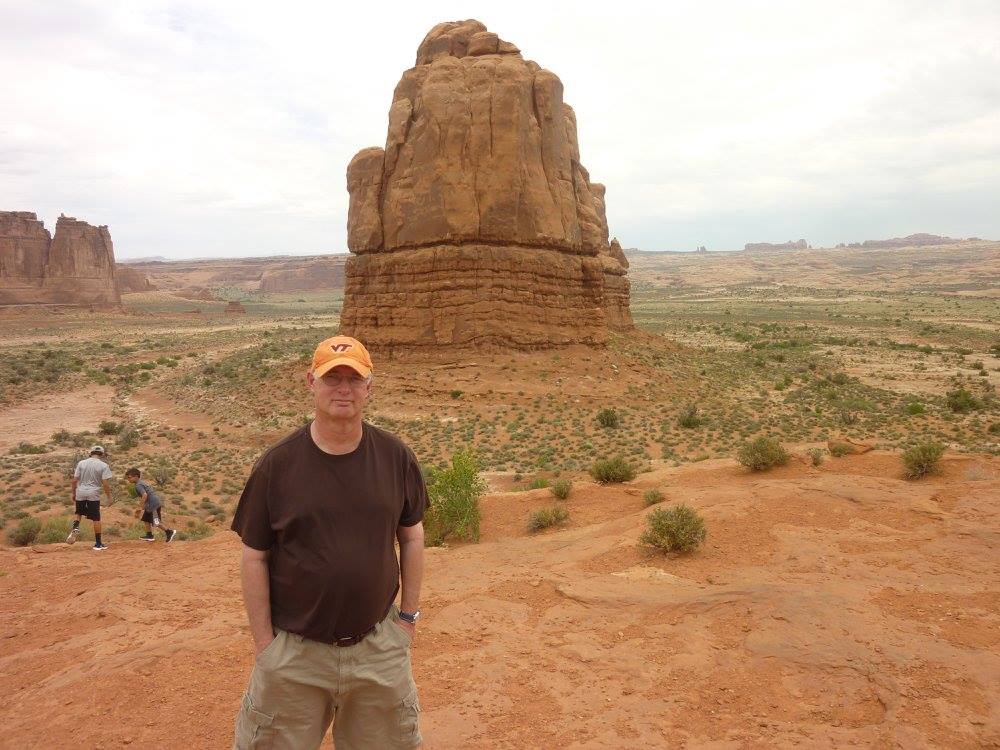 Kenneth Noe standing in Arches National Park, Utah.